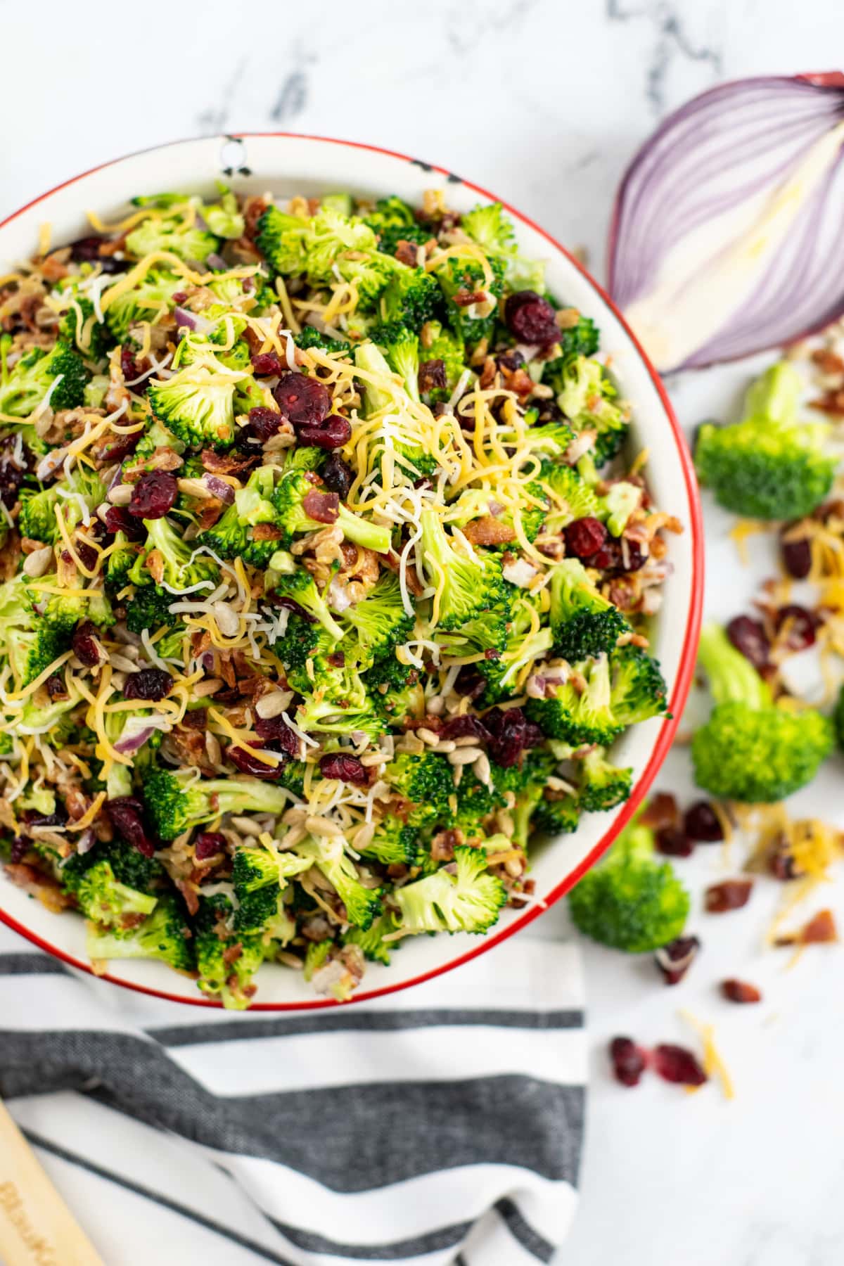 Large bowl filled with broccoli salad with craisins
