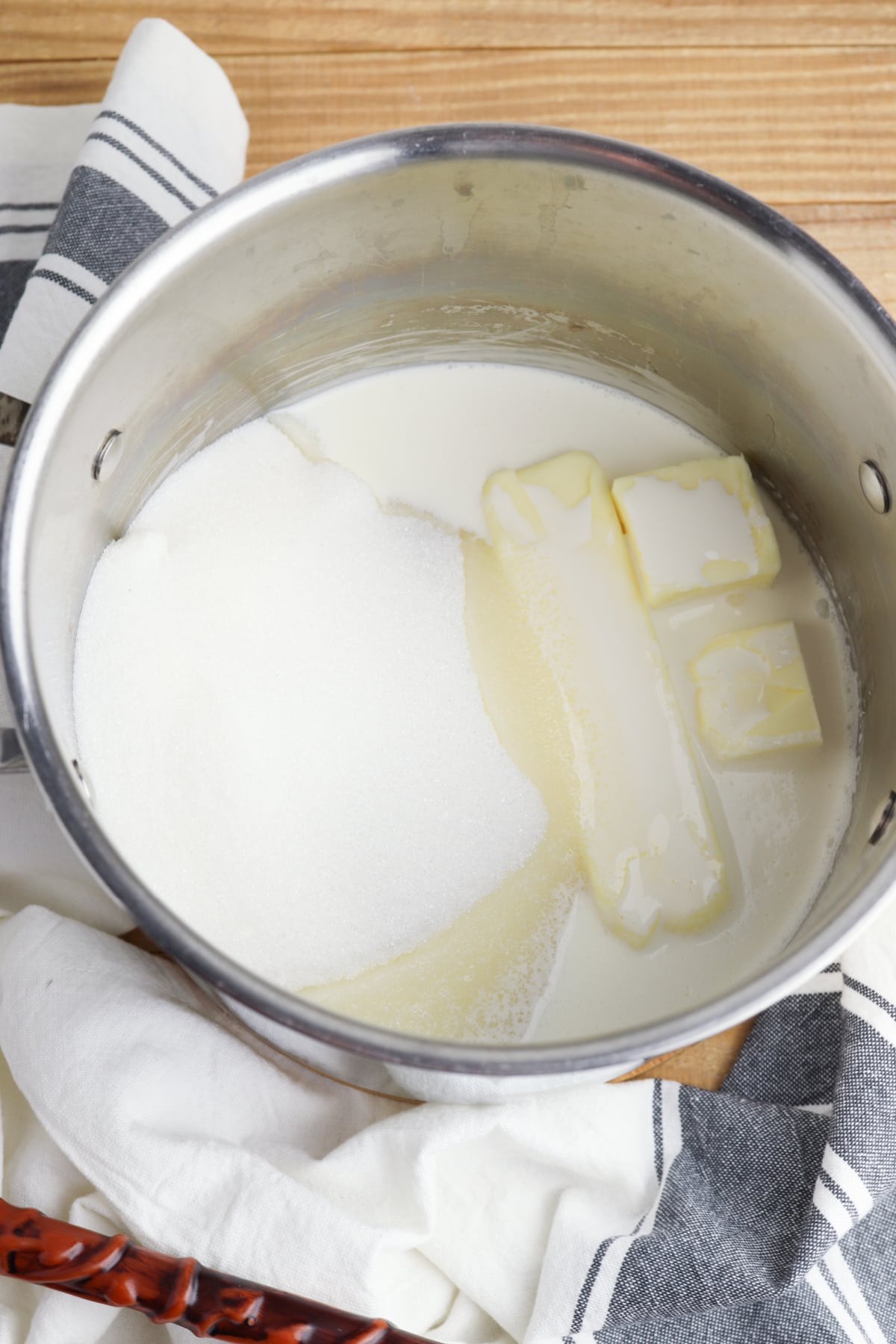 Saucepan with butter, sugar and cream