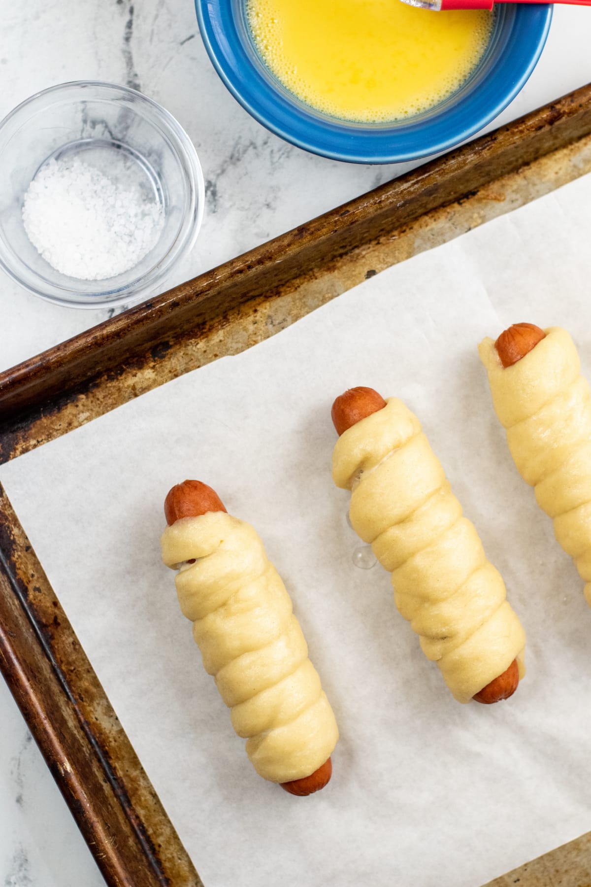 Hot dogs wrapped in pretzel dough