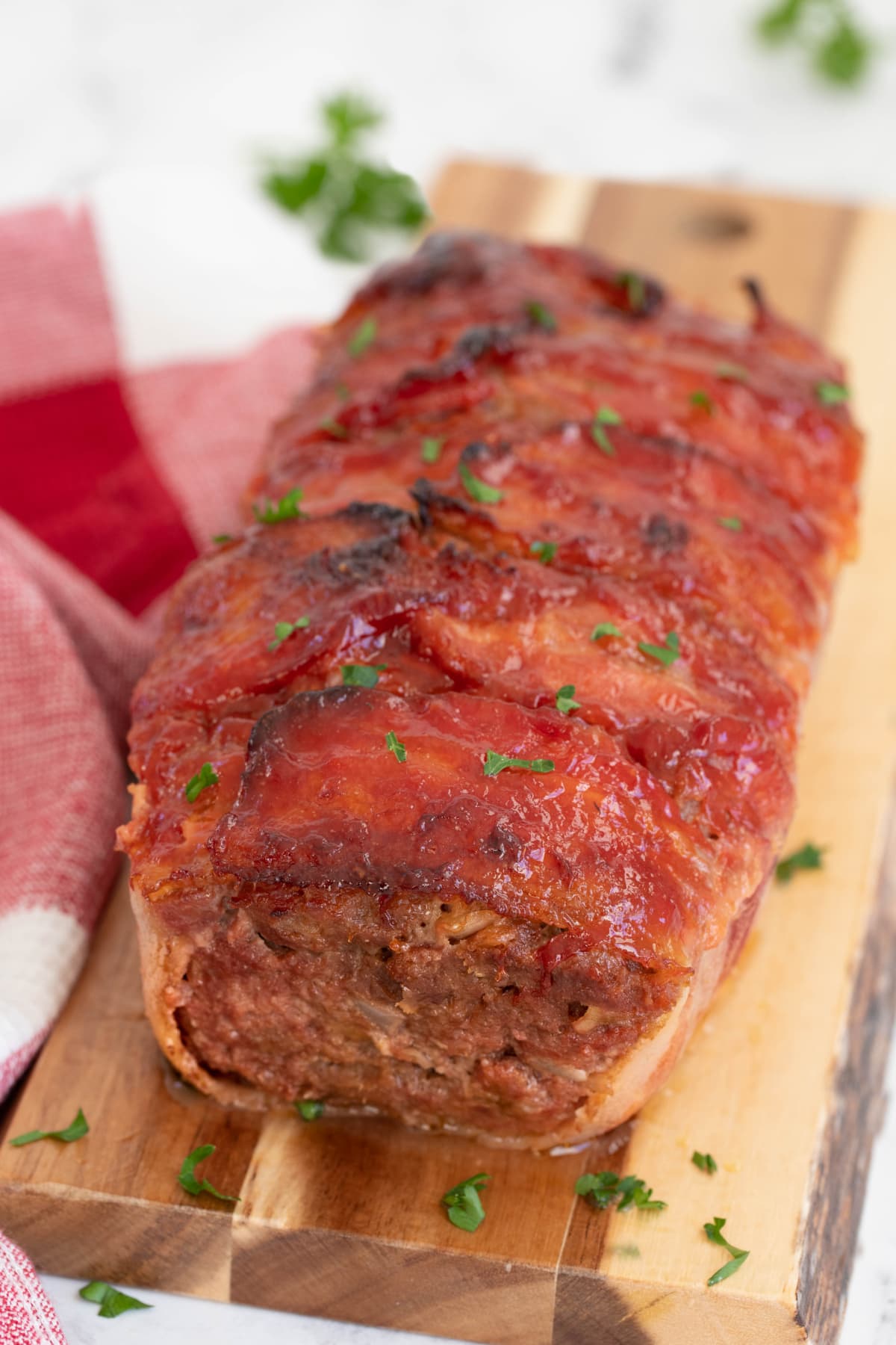 Bacon Wrapped Meatloaf on wooden board