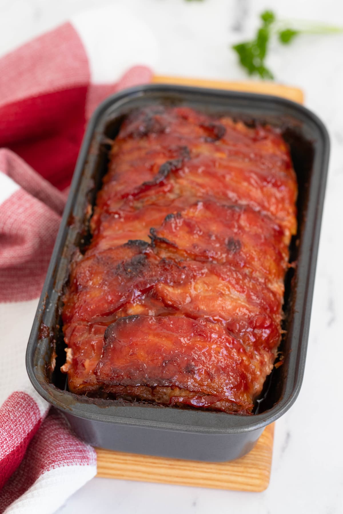 Bacon wrapped meatloaf in pan