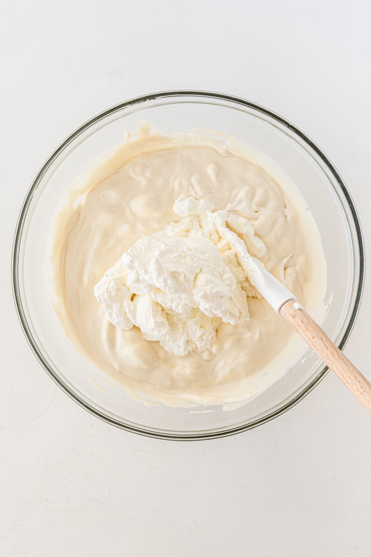 Whipped cream combined with condensed milk and vanilla