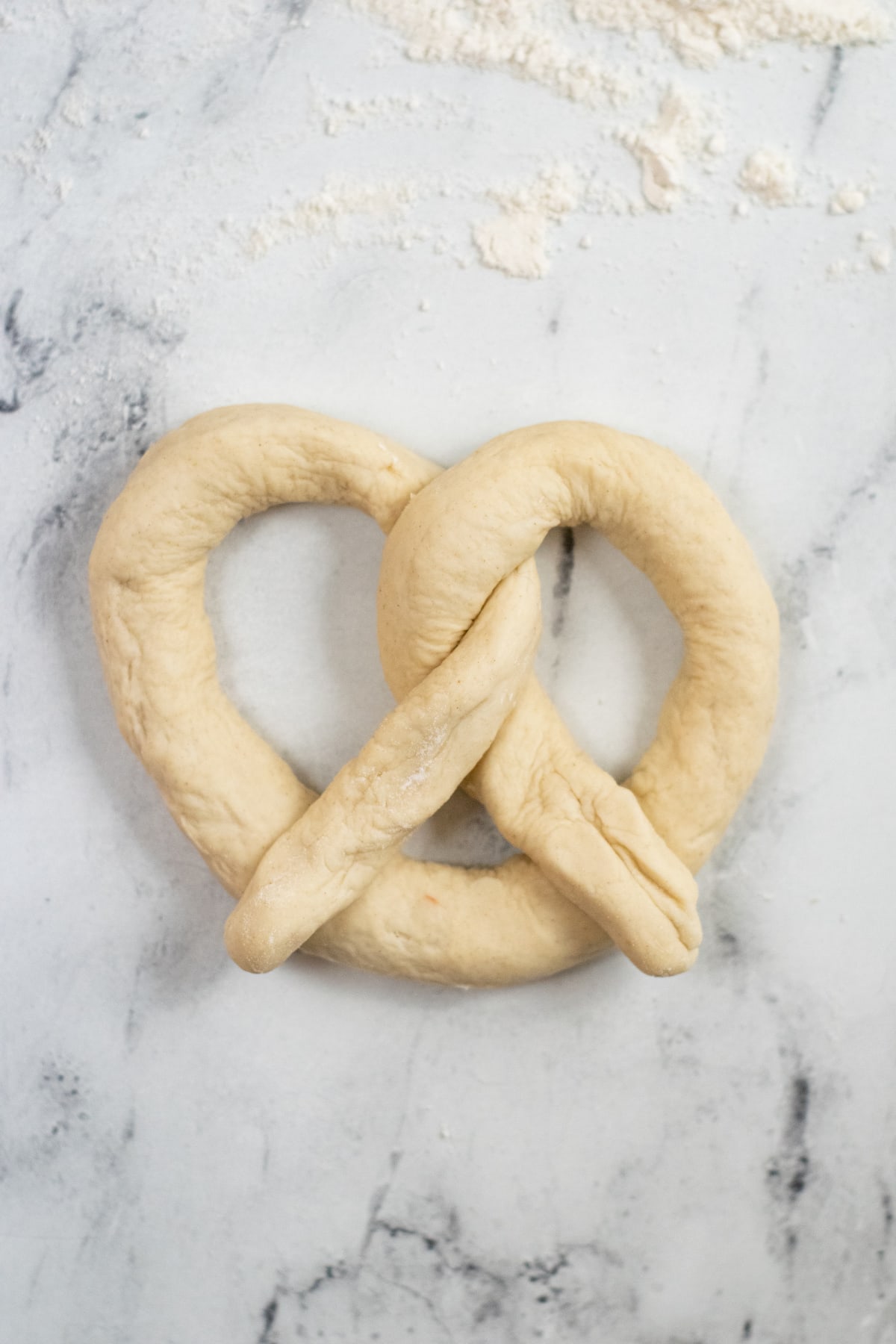 Dough shaped into a pretzel shape