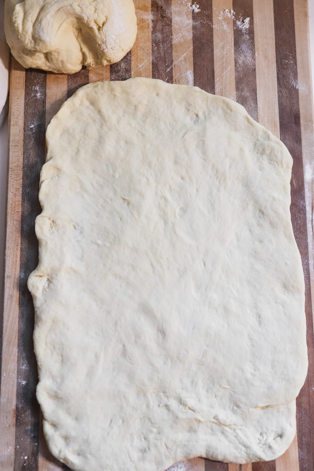 Dough stretched on cutting board