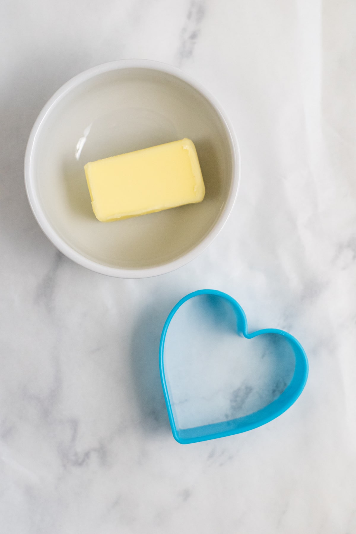 Butter in bowl with a heart shaped cookie cutter
