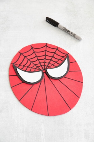 Continuing the spiderweb pattern on Spiderman's face