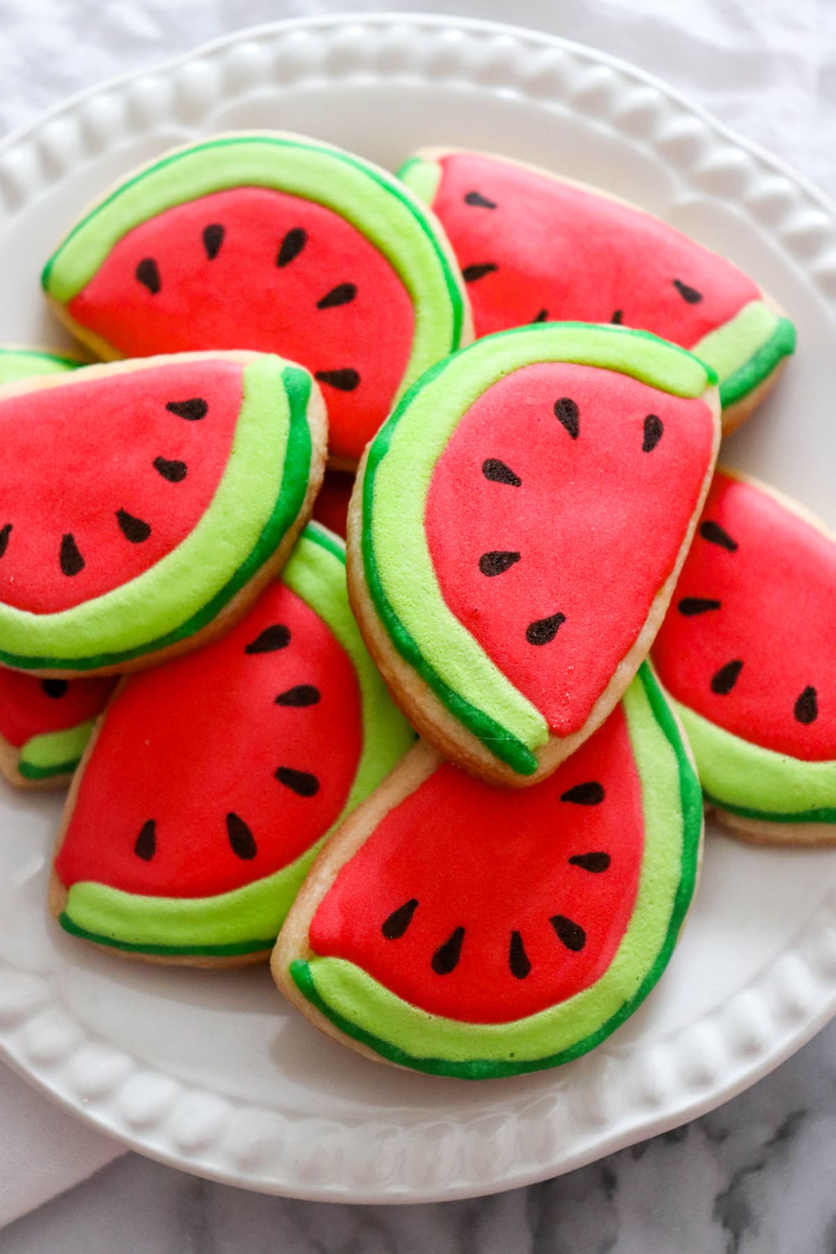 Watermelon cookies on white plate