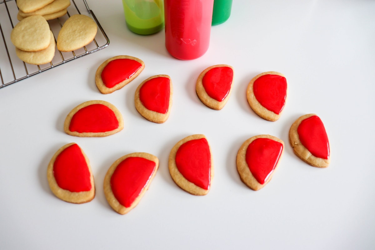 Red icing on watermelon shaped cookies