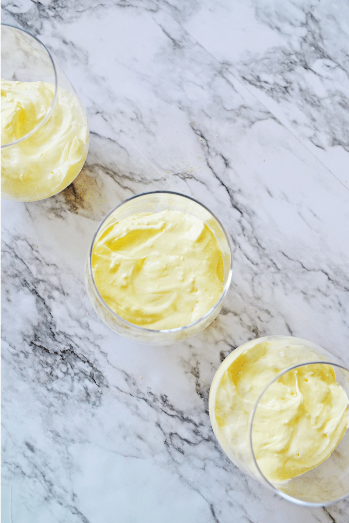 Glasses with lemon cheesecake added