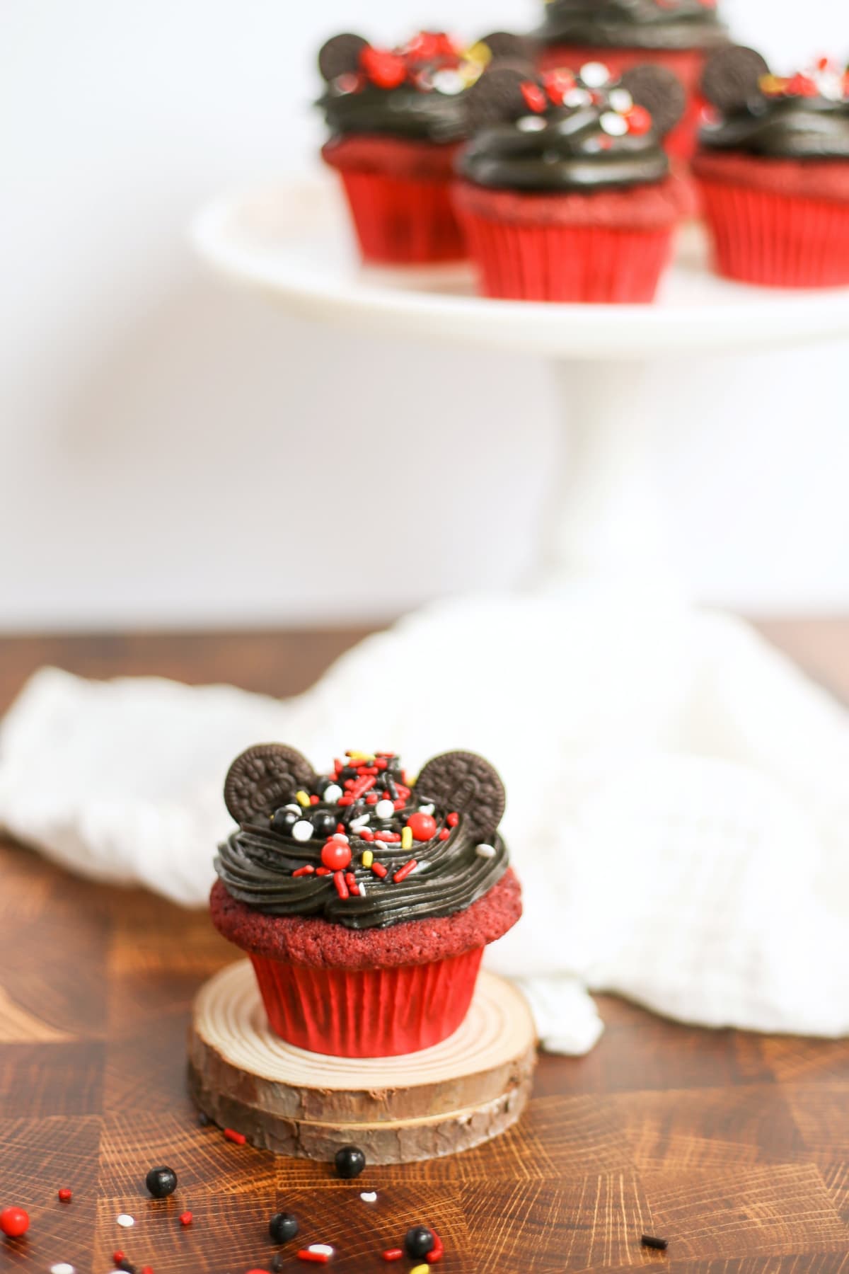 Mickey Mouse cupcake on a piece of round wood