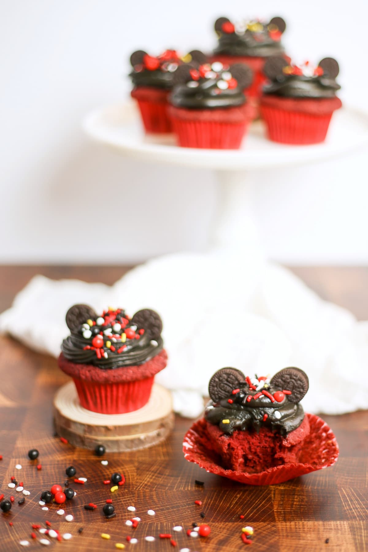 Mickey Mouse cupcakes, one with a bite taken out