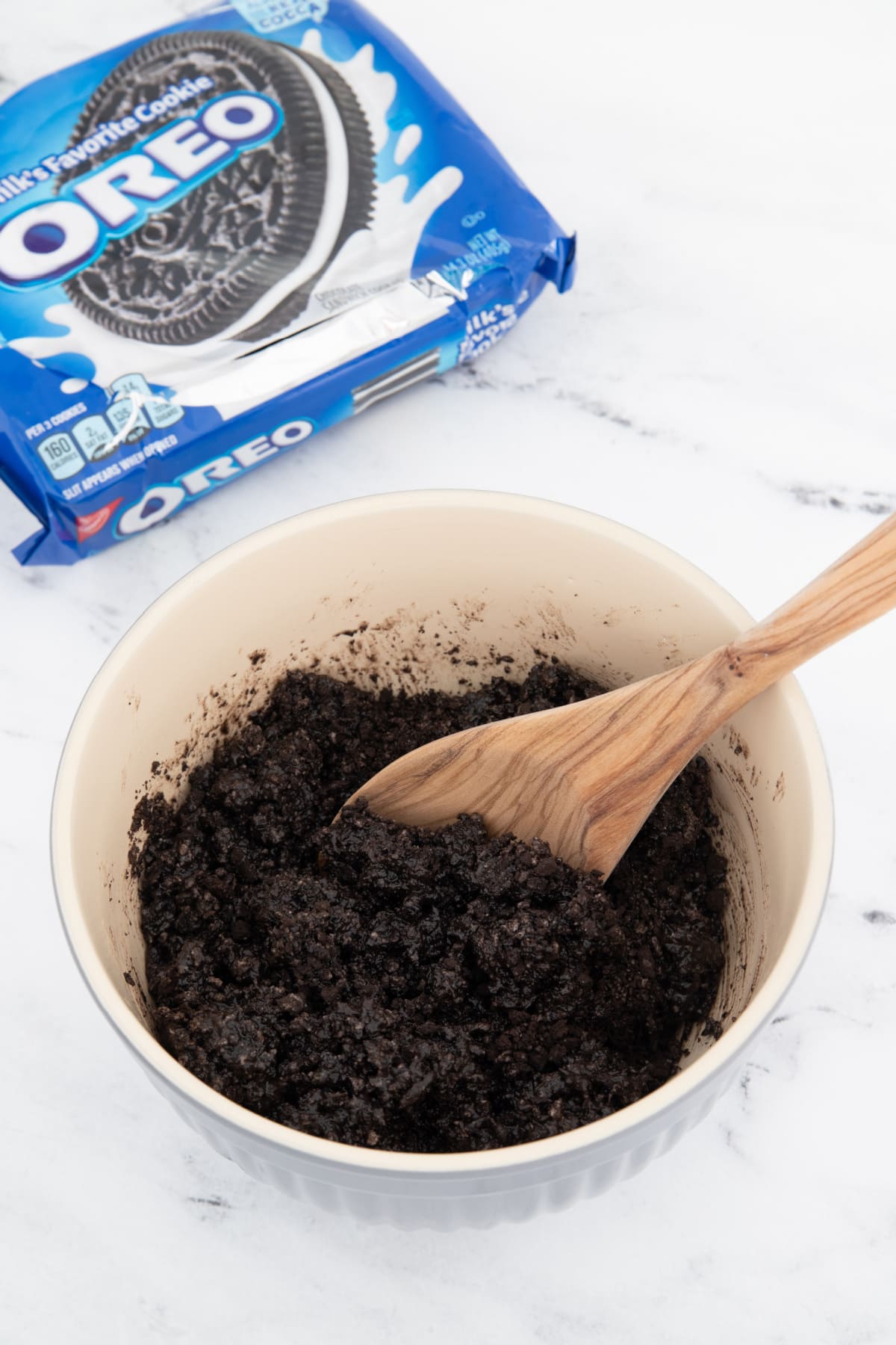 Oreo crumbs and butter in bowl