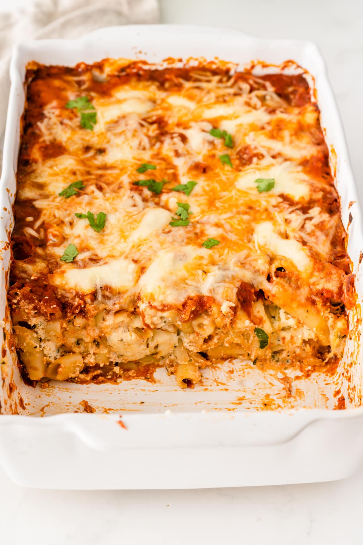 Baked ziti with several slices removed