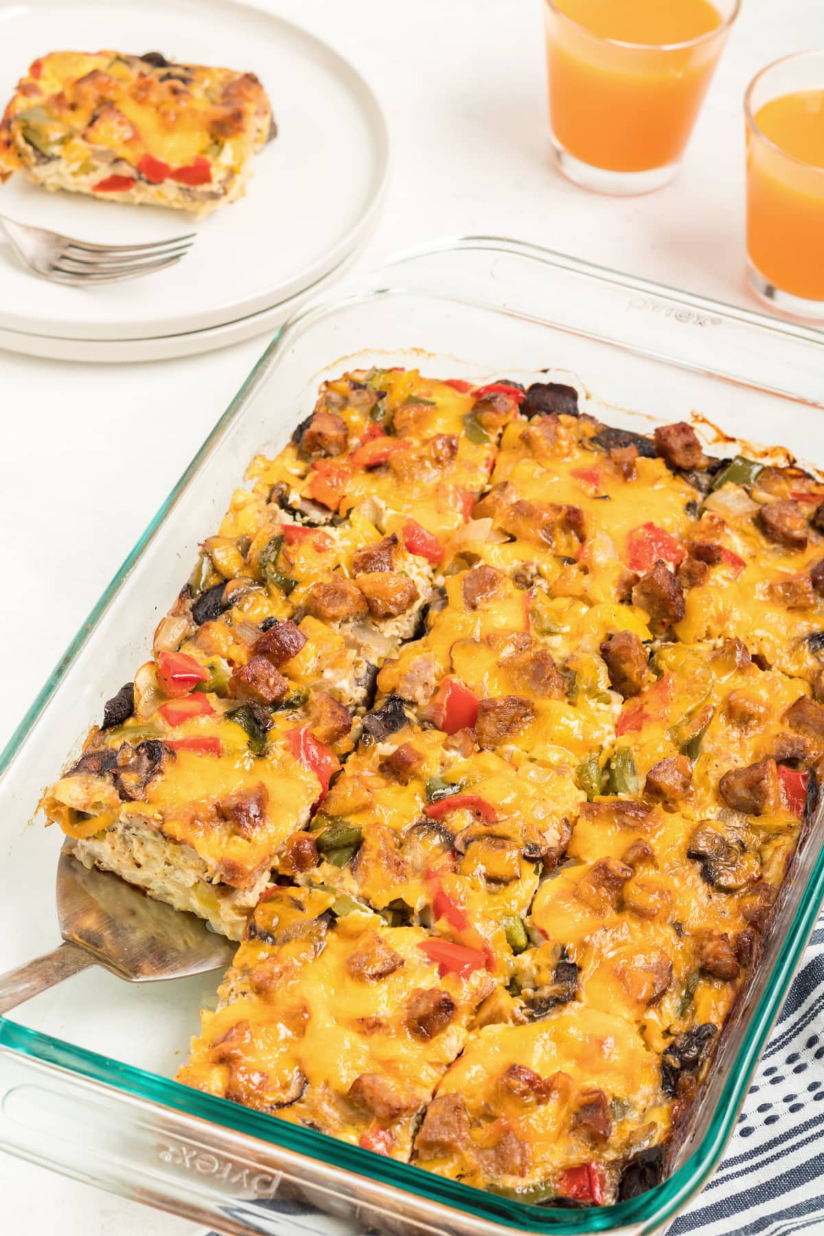Sausage Egg And Cheese Breakfast Casserole cut into pieces