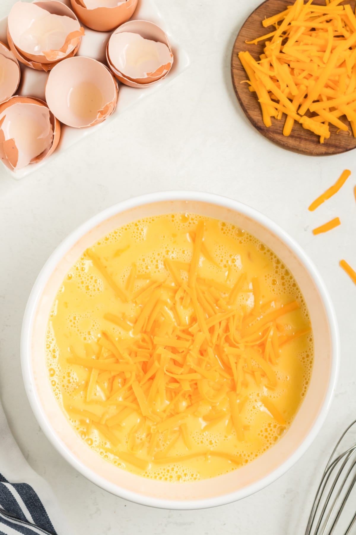 Shredded cheese in egg mixture