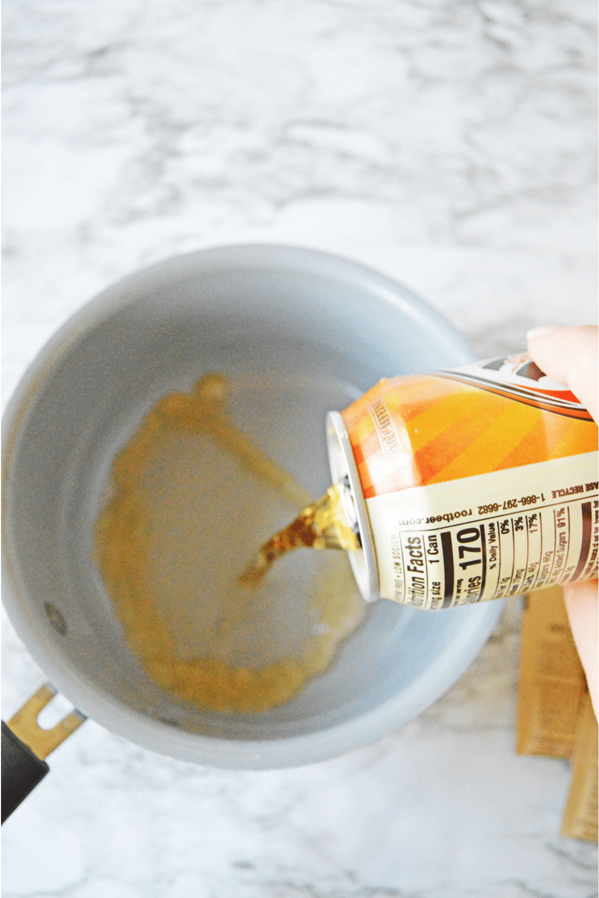 Pouring cream soda into saucepan