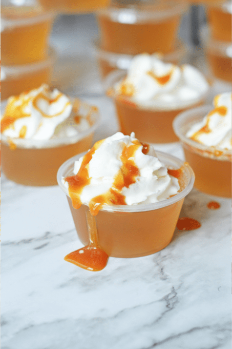 Butterbeer jello shot drizzled with butterscotch syrup