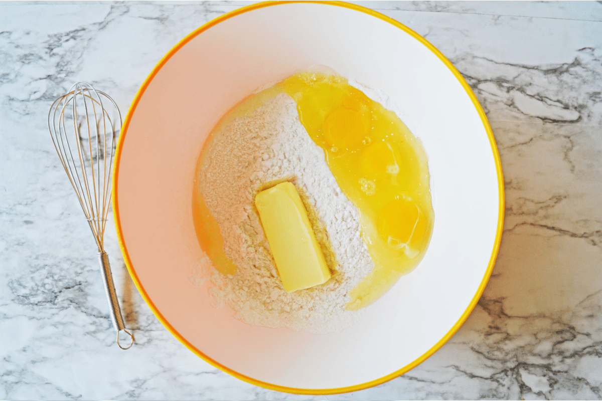 Cake mix, butter and eggs in bowl