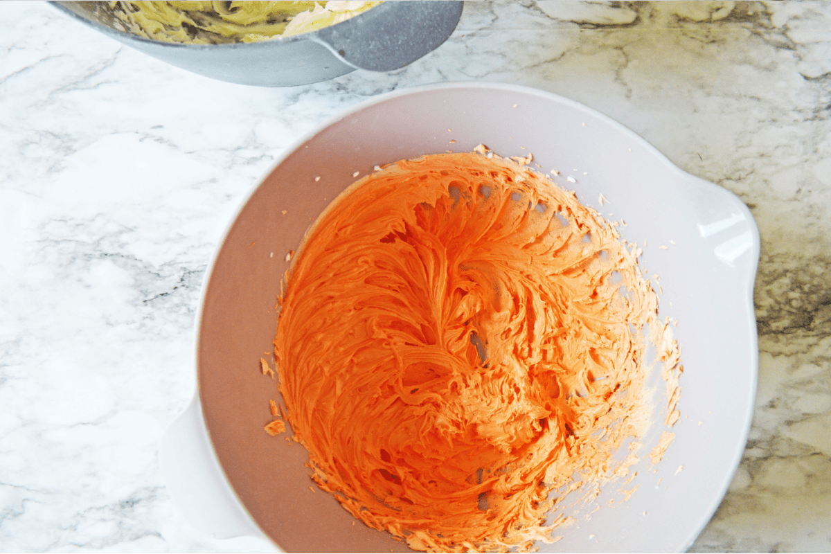 Frosting mixed with orange food coloring