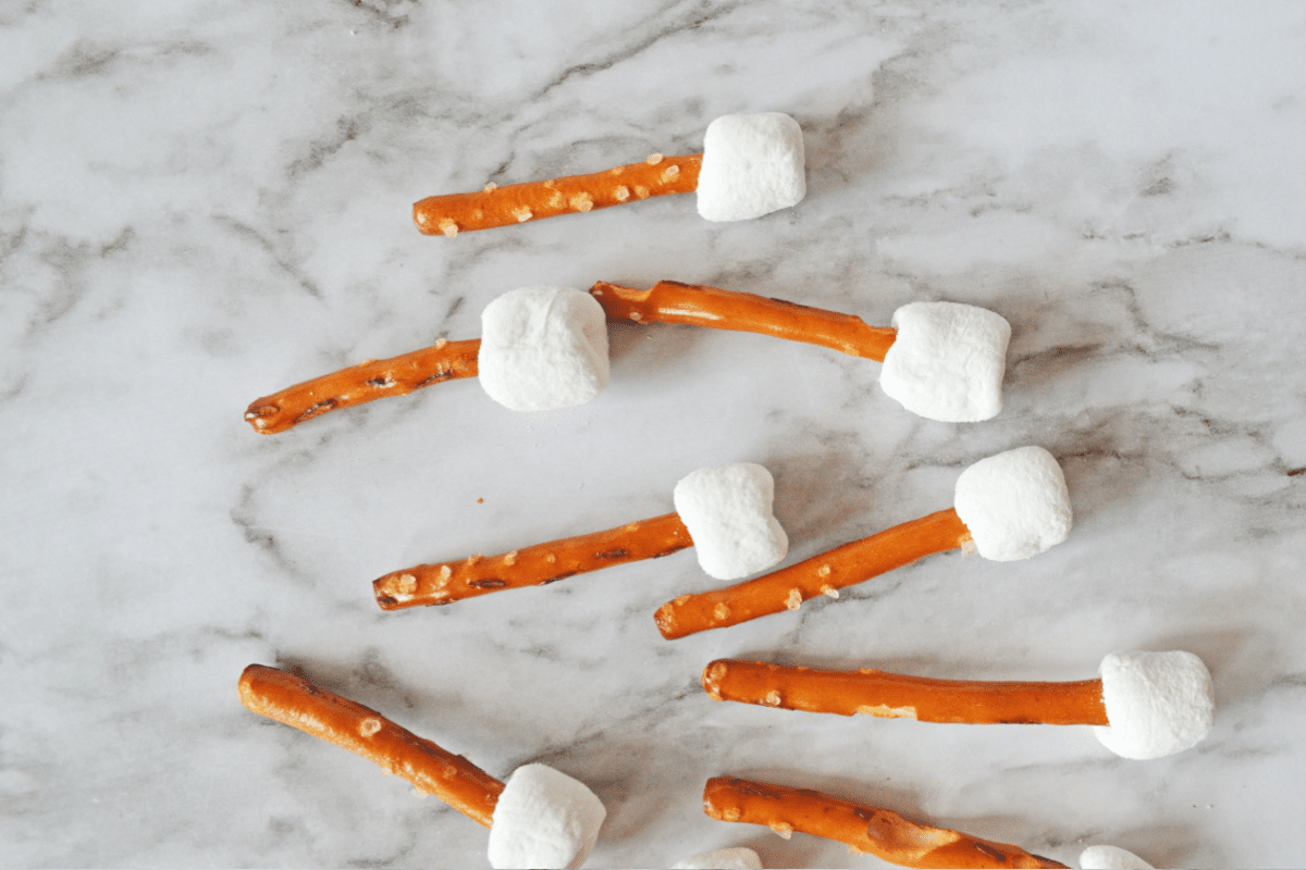 Mini marshmallows on pretzel sticks