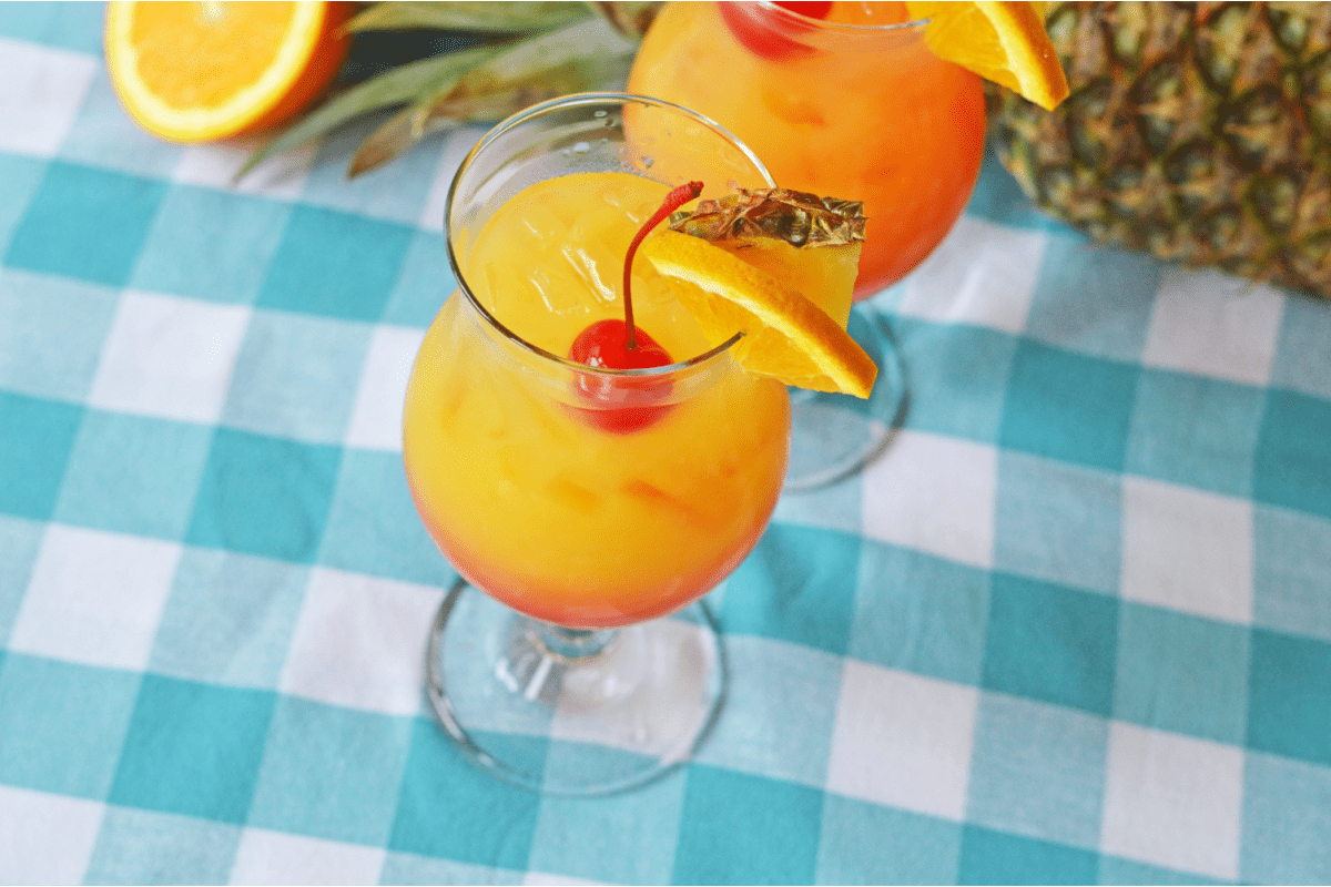 Caribbean Rum Punch with blue checkered tablecloth