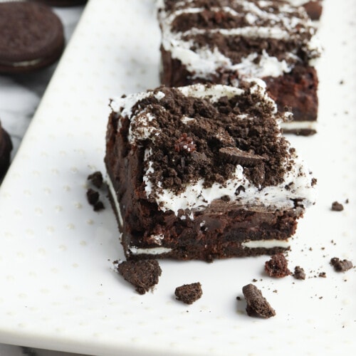 Oreo Brownie on white plate with crumbs