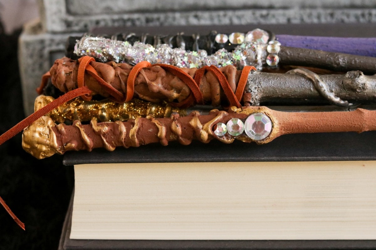 DIY Harry Potter Wands laying on book