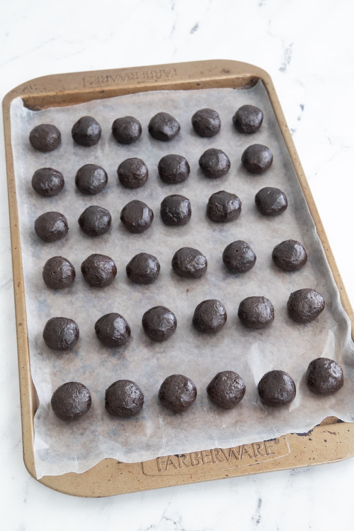Oreo cookie balls on cookie sheet