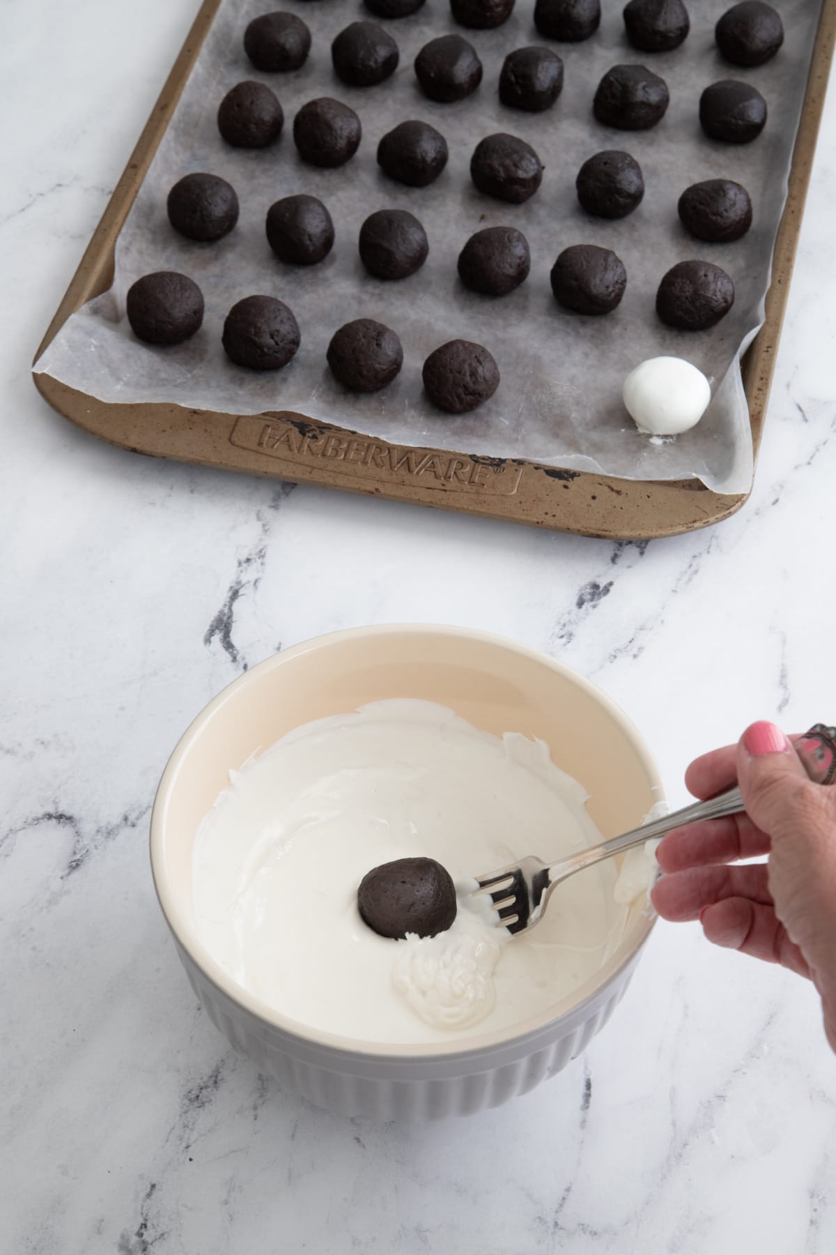 Oreo ball dipped in melted white chocolate