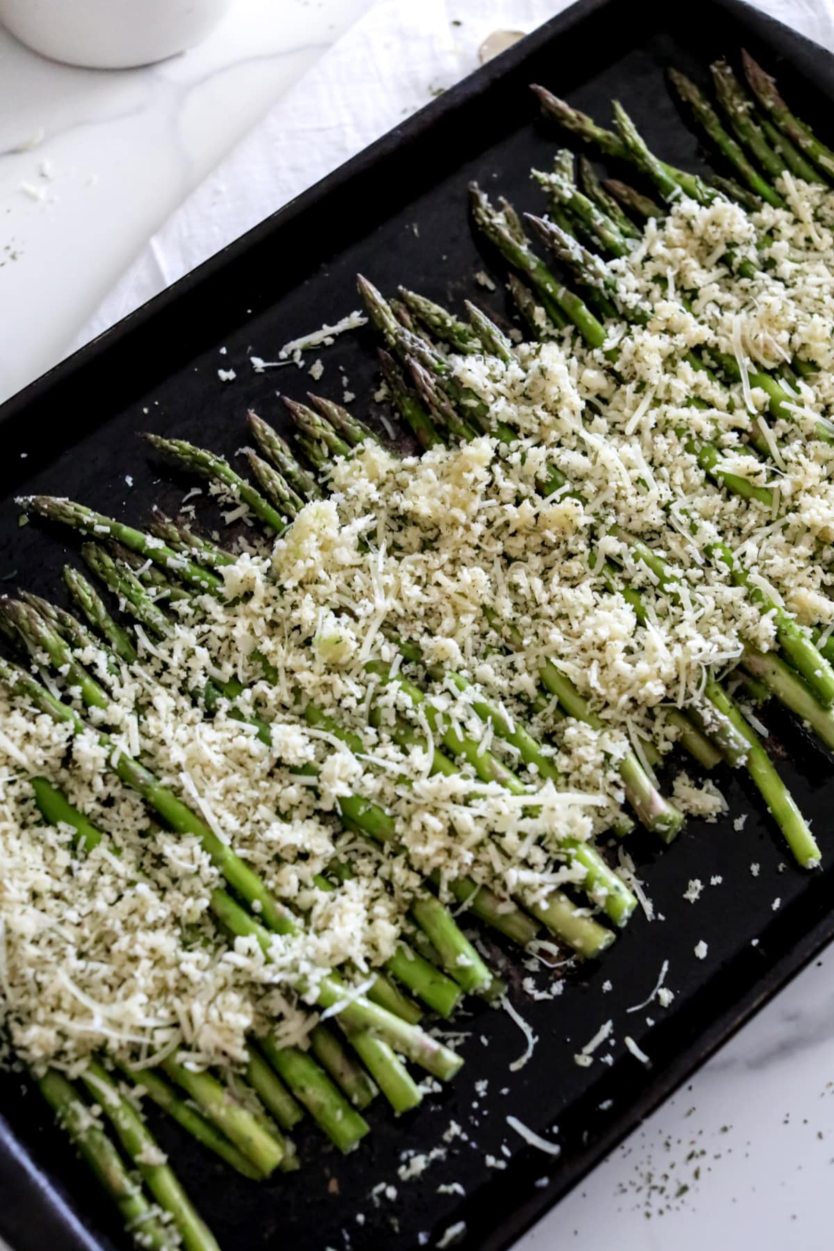 Parmesan asparagus on baking sheet