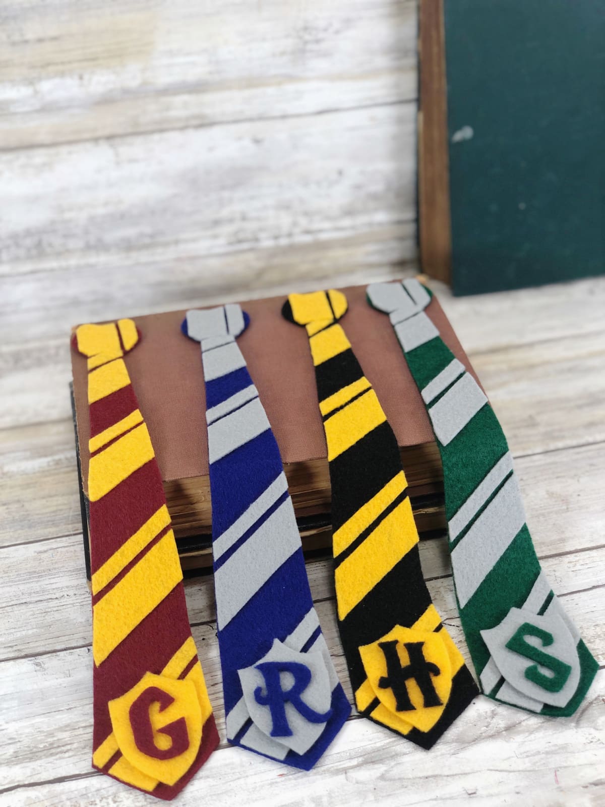 Completed Harry Potter bookmarks draped over book