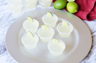 Margarita shots with lime wedge