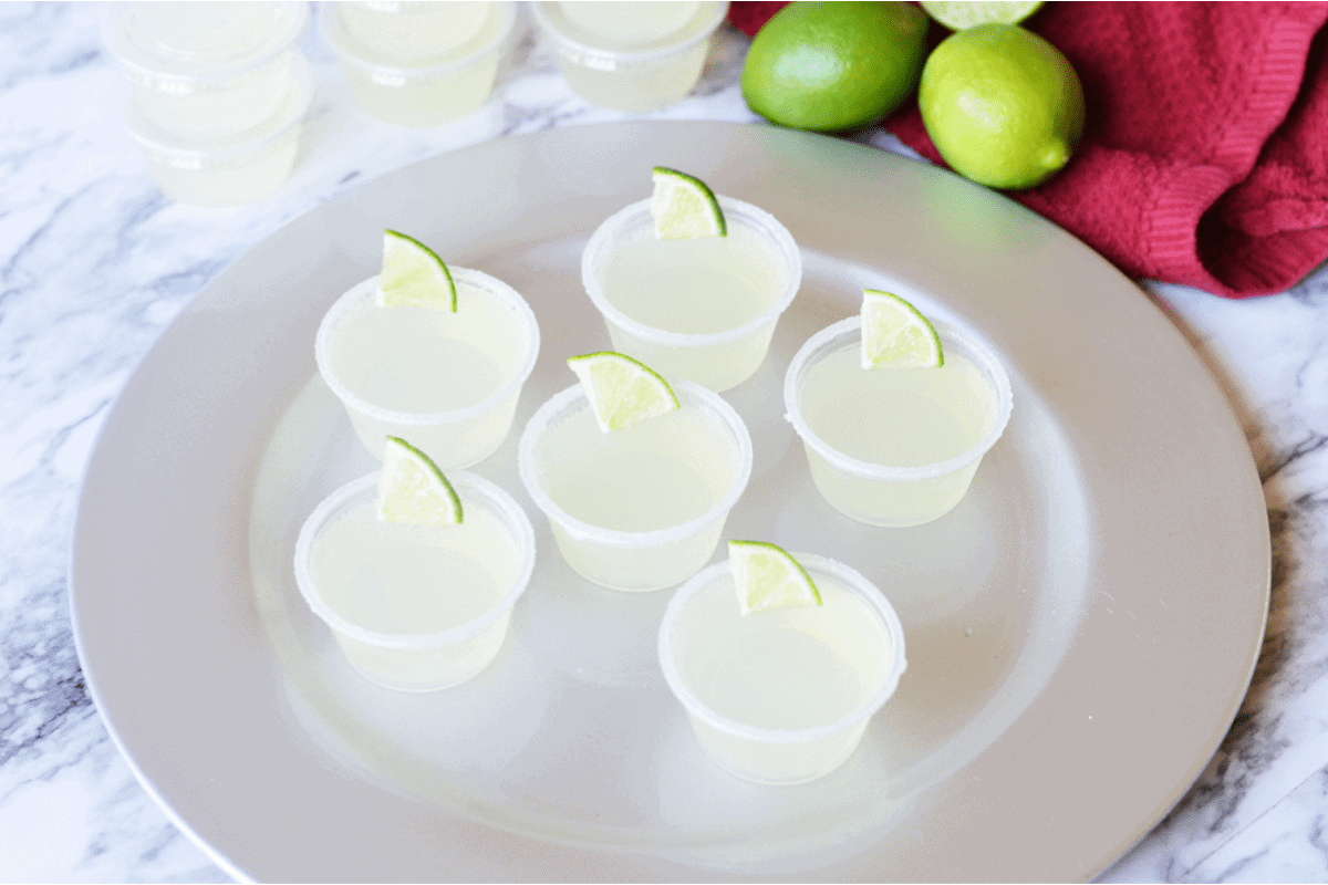 Margarita shots with lime wedge