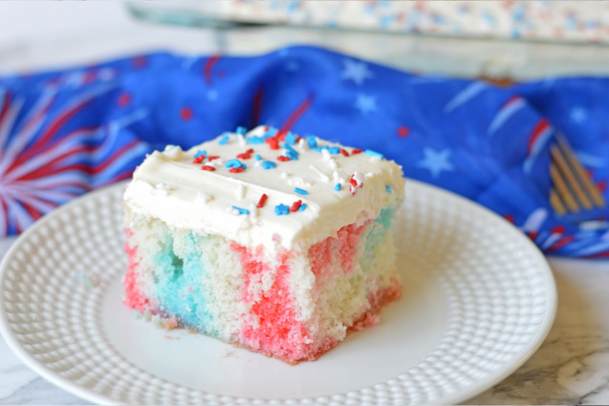 Red White And Blue Poke Cake on white plate