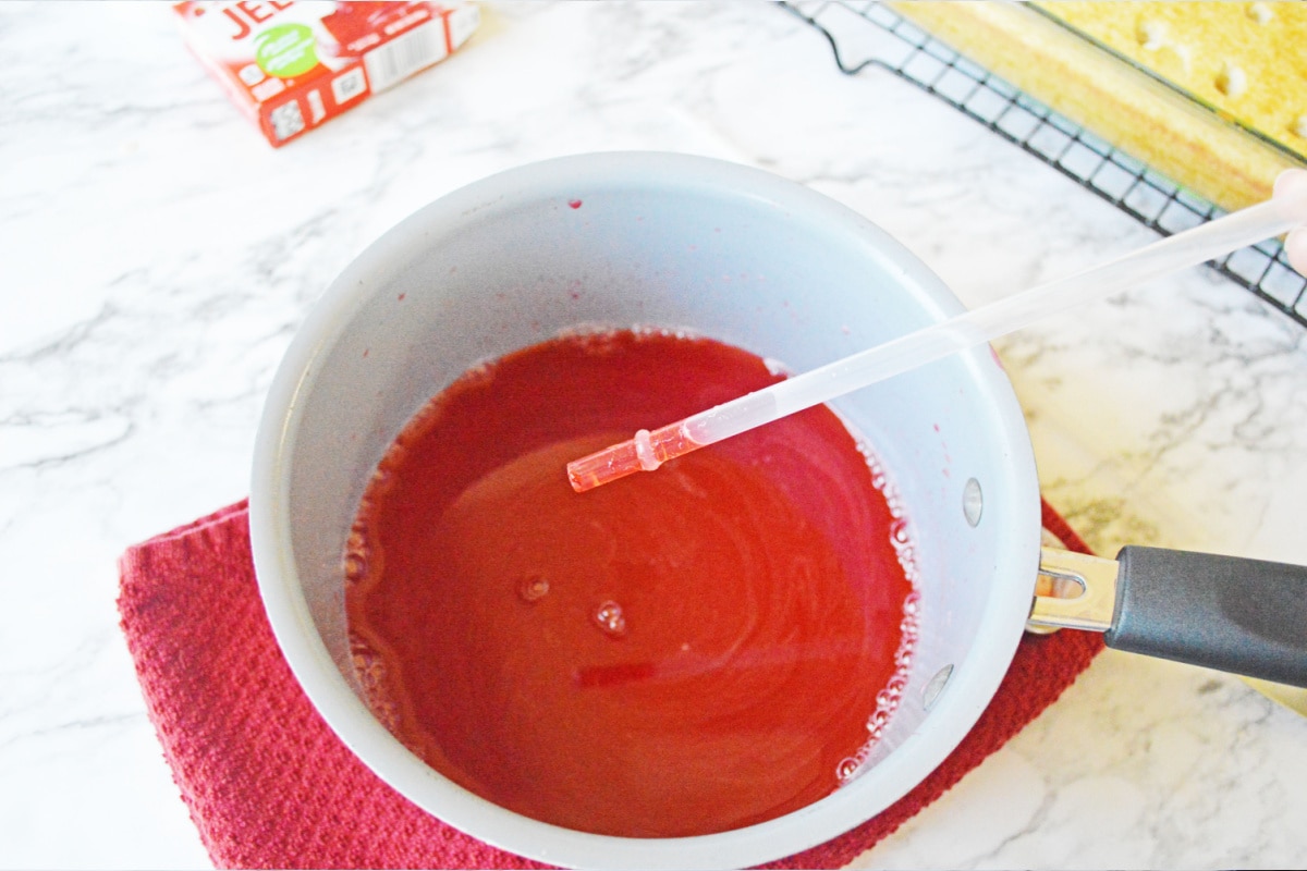 Red jello in straw