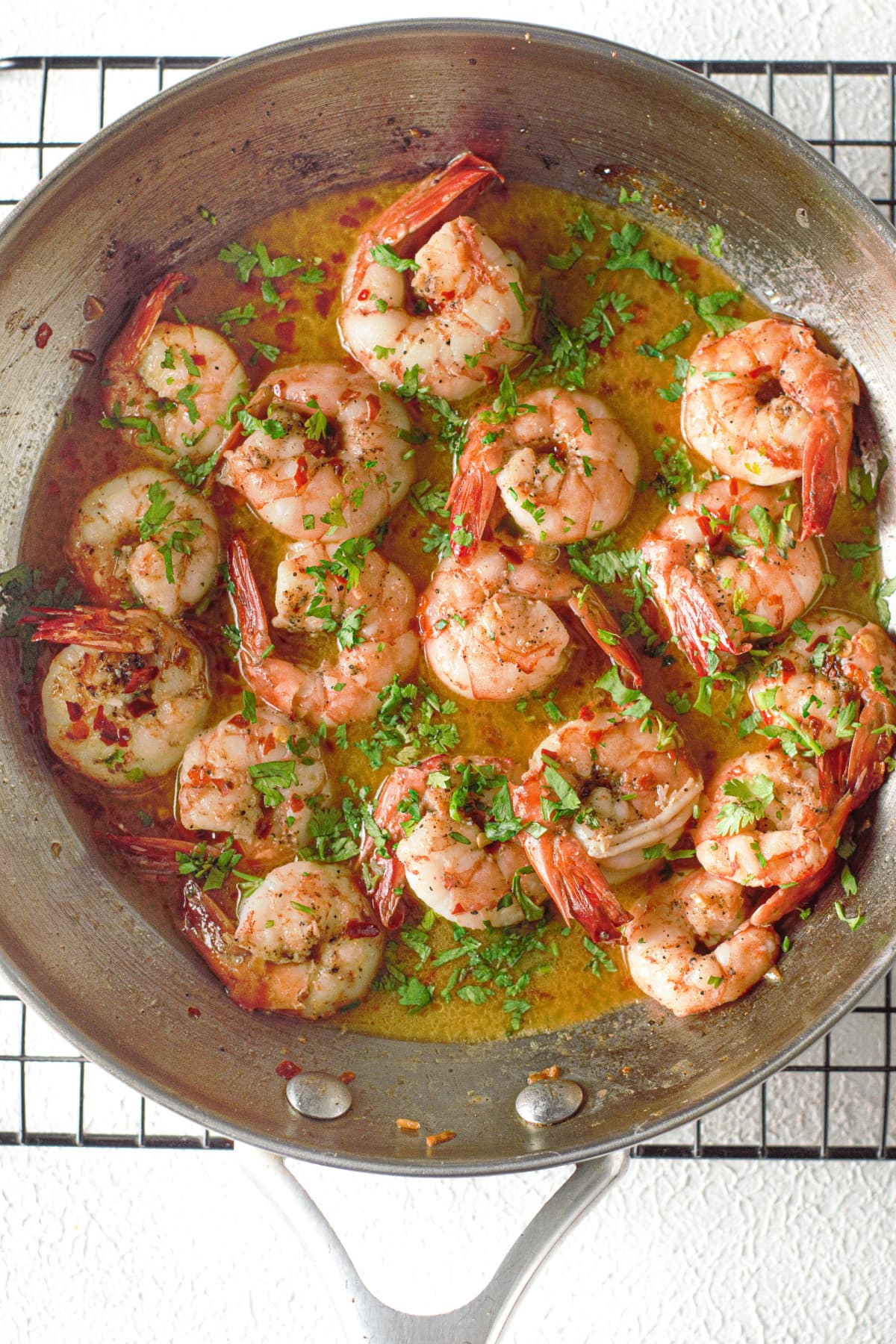 Shrimp scampi in pan with parsley