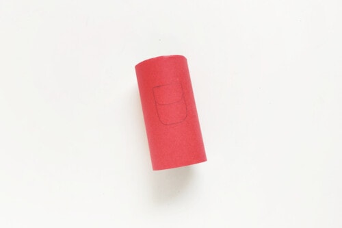 Toilet paper roll covered in red construction paper