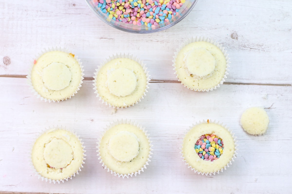 White cupcakes with sprinkles inside