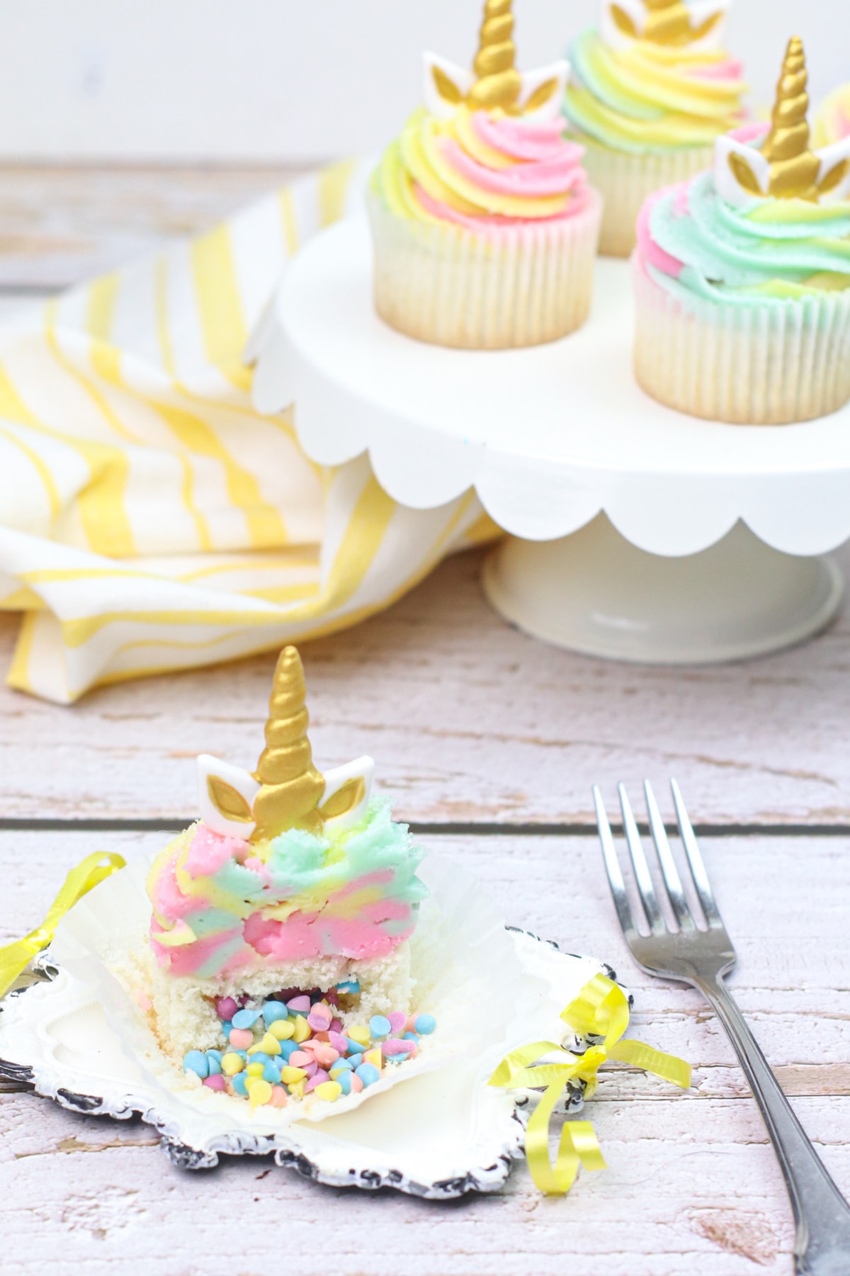 Unicorn cupcake with sprinkles pouring out