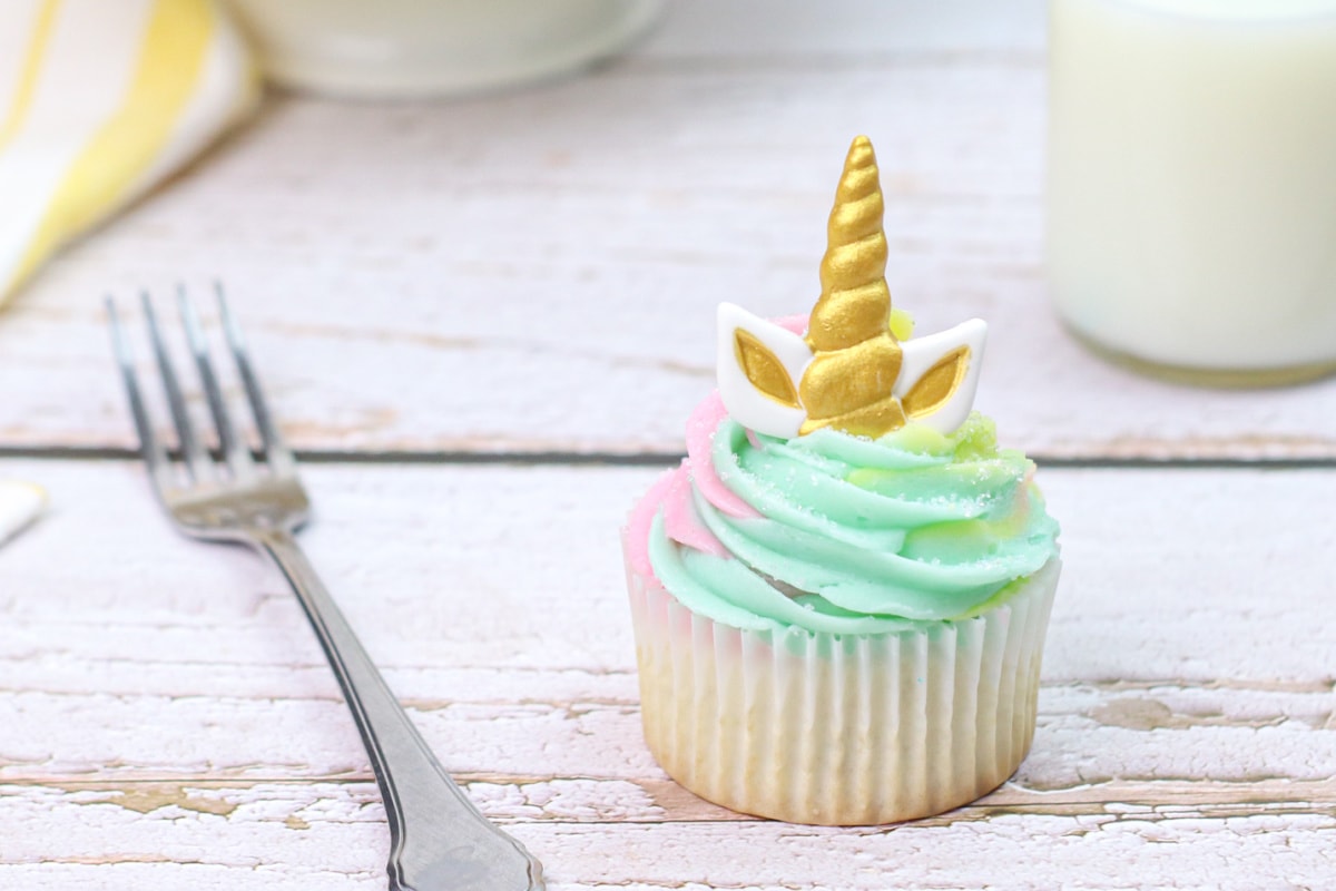 Unicorn cupcake up close with fork