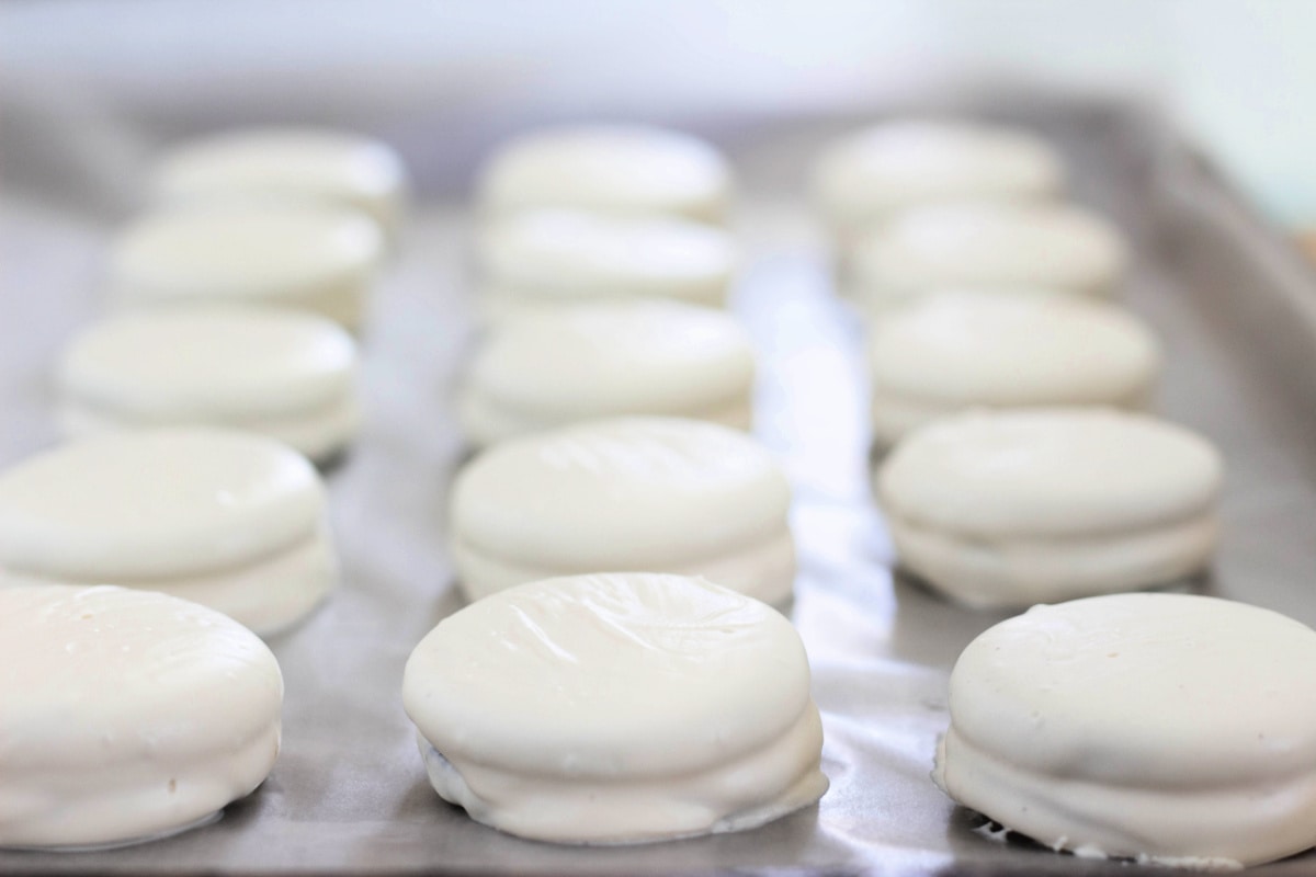 White chocolate covered Oreos on cookie sheet