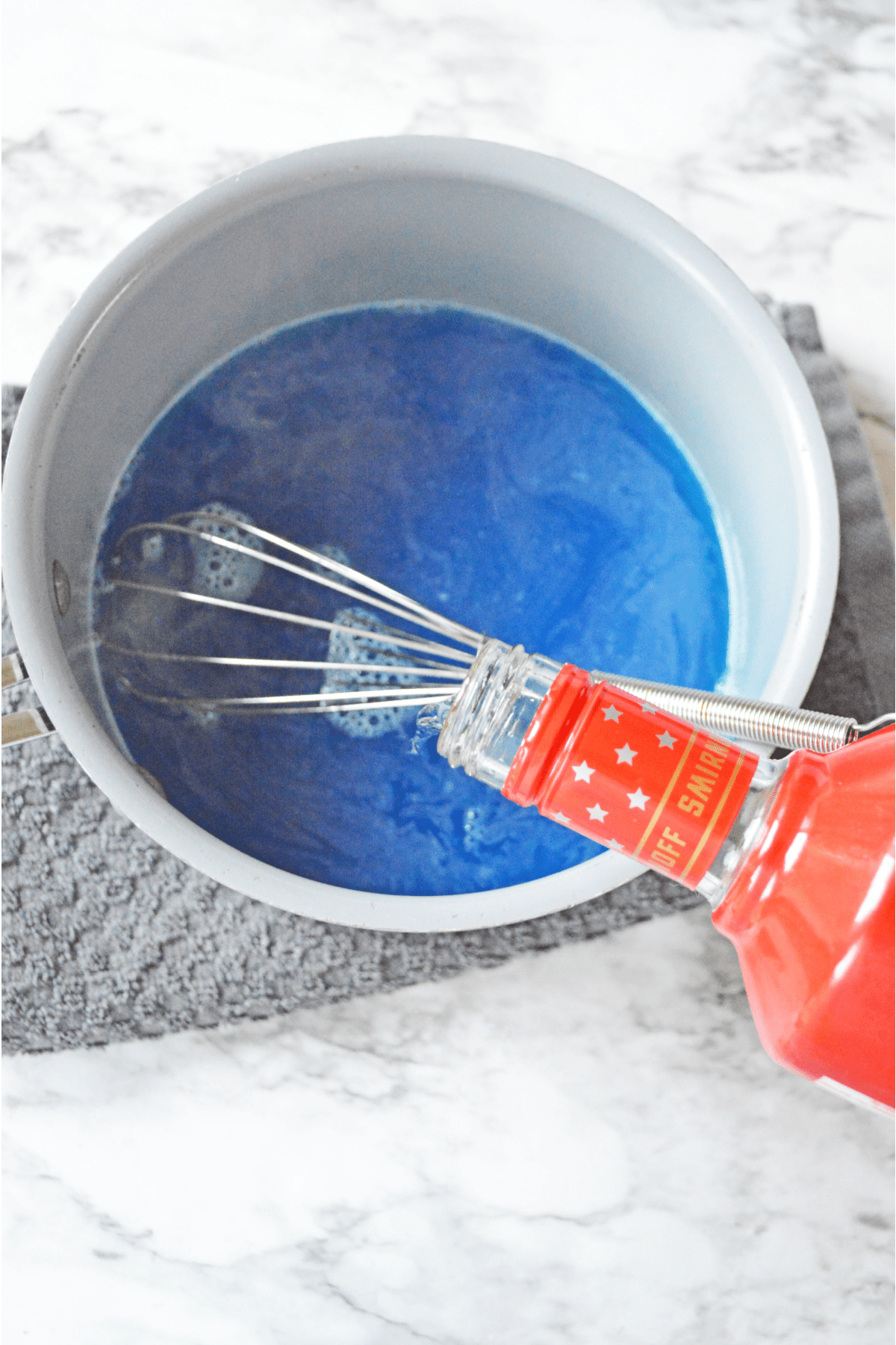 Adding vodka to blue jello