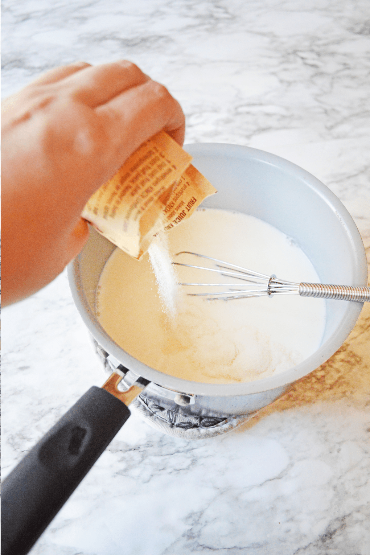 Pouring gelatin into condensed milk