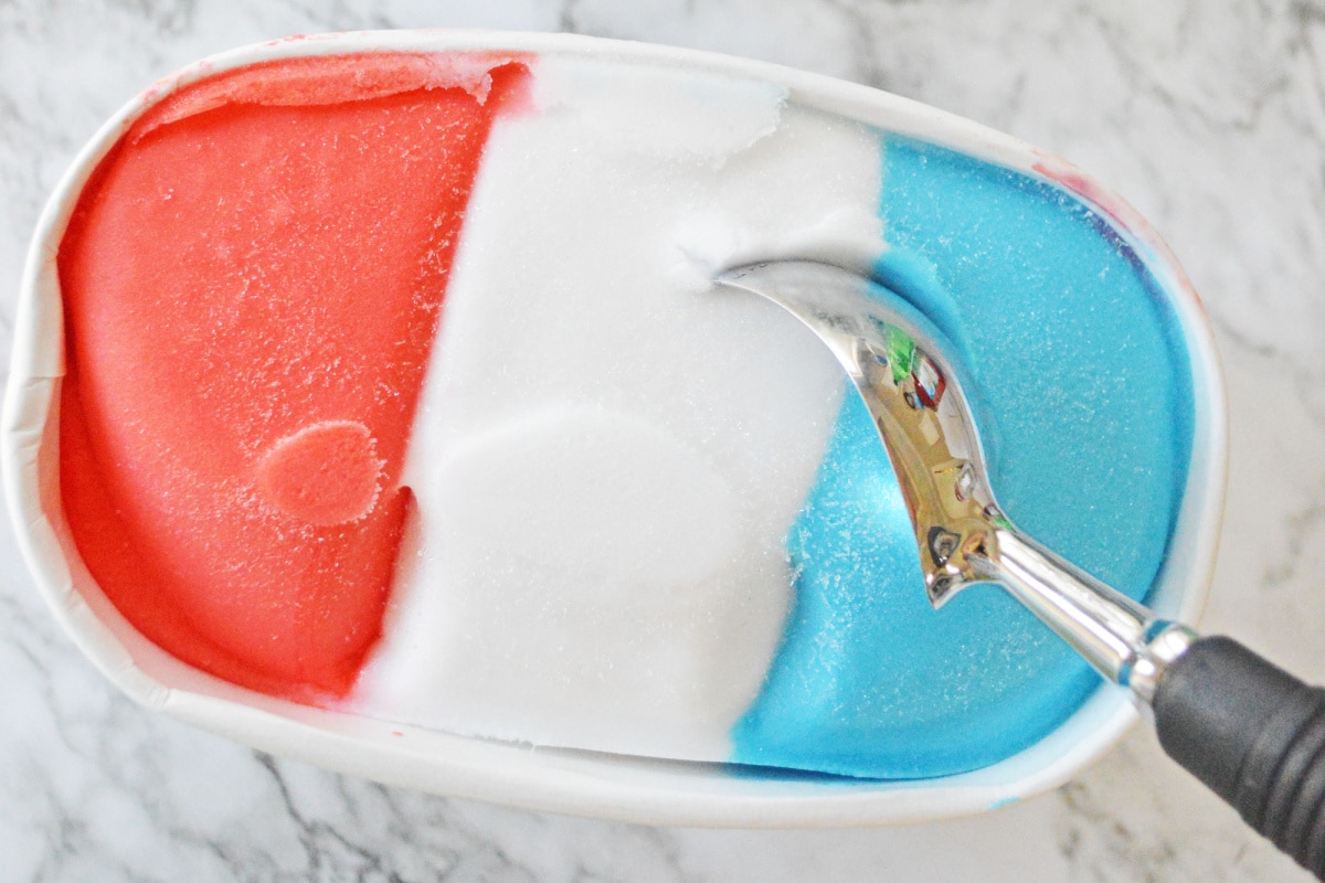 Red white and blue sorbet with ice cream scoop