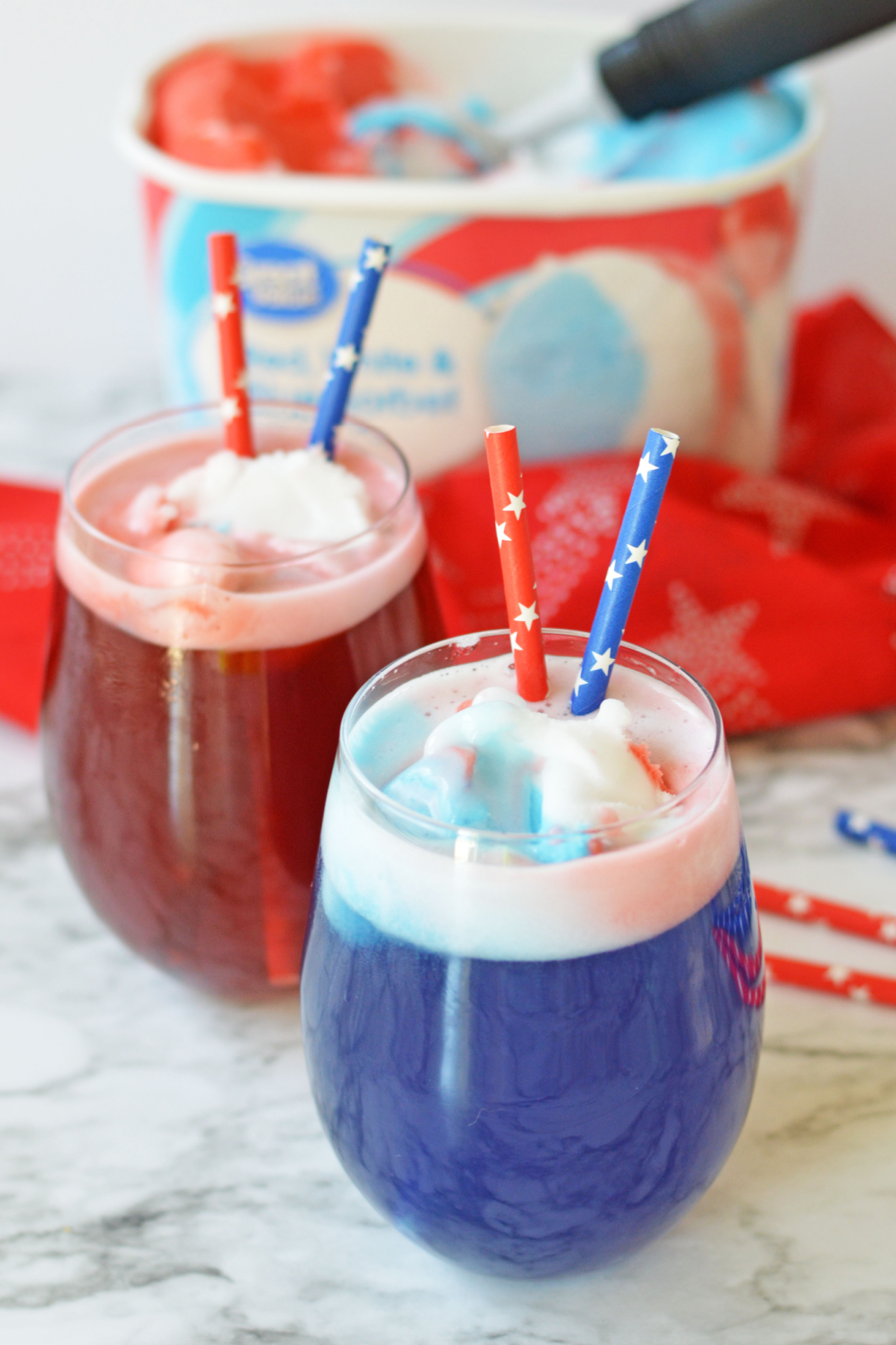 Red, white and blue punch with sorbet in background