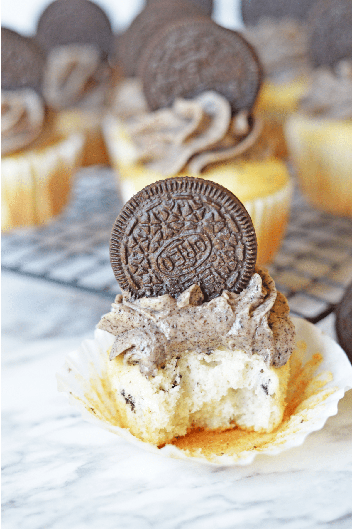 Oreo cupcake with a bite out
