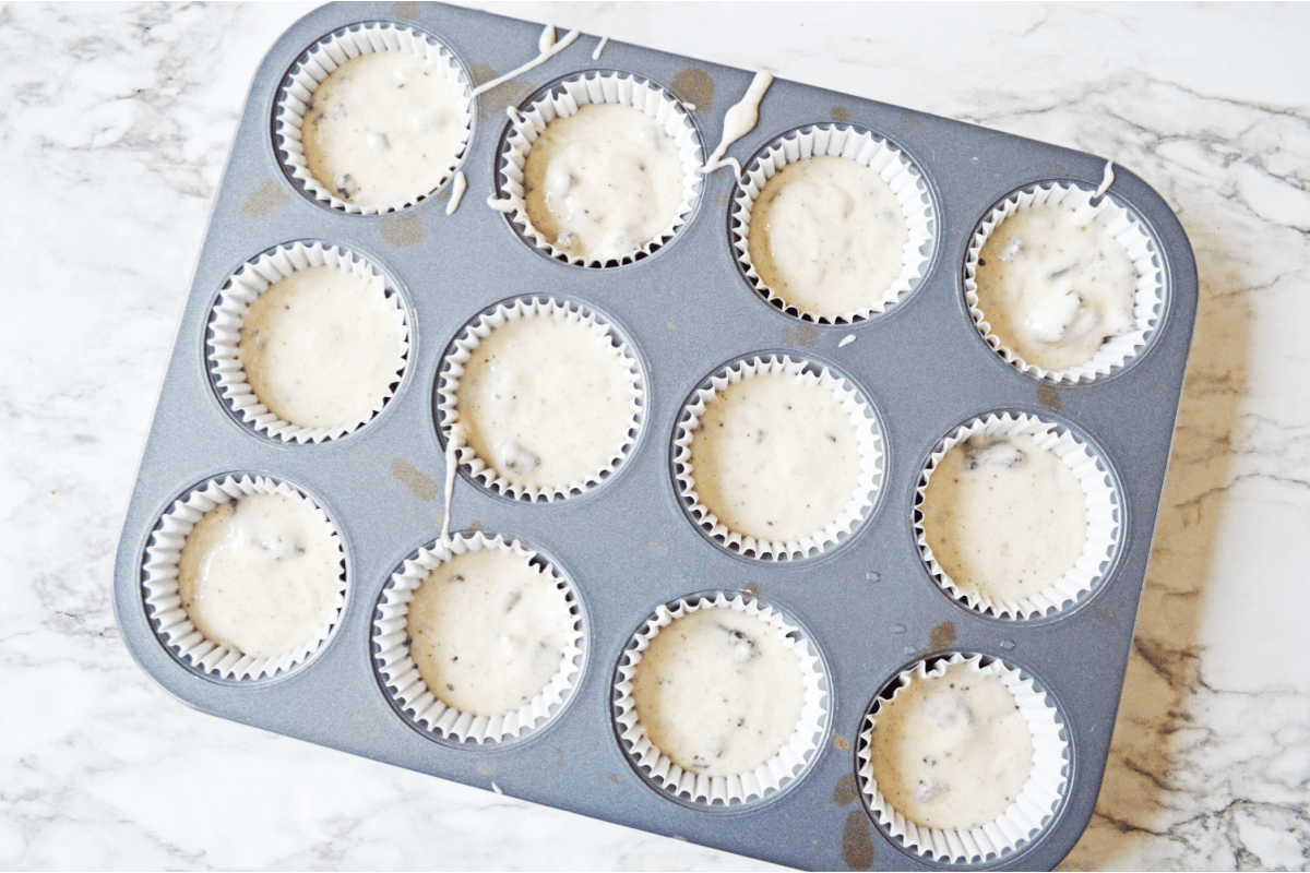 Oreo cupcake batter in muffin tin