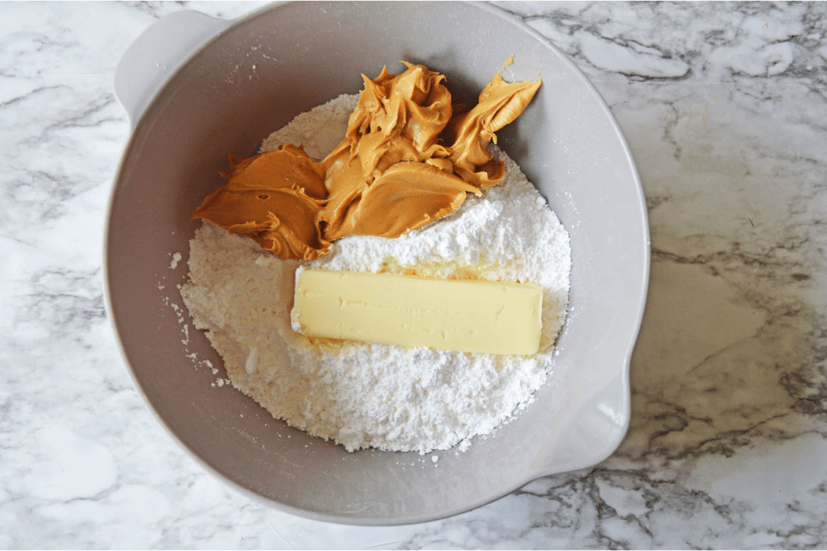 Peanut butter, powdered sugar and butter in bowl