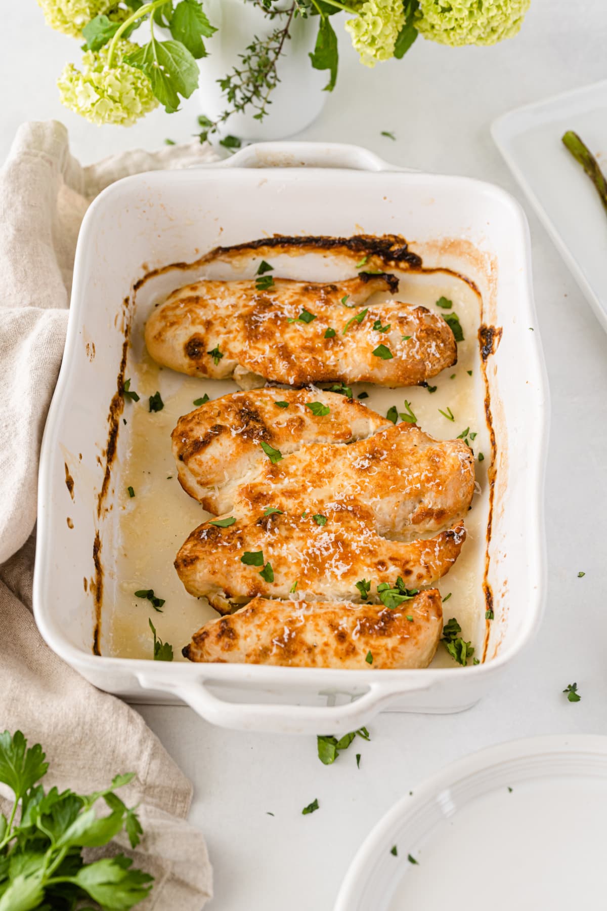 Baked parmesan crusted chicken in baking pan