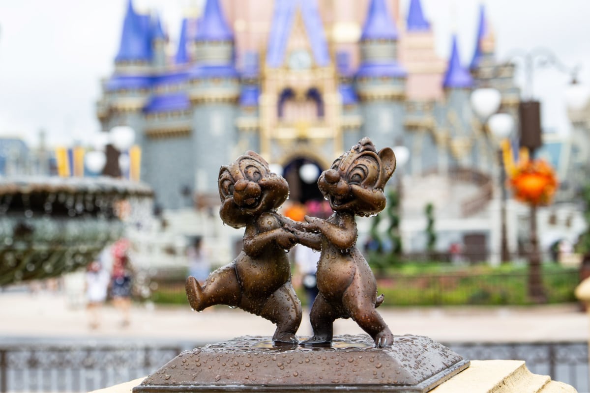 Chipmunks dancing in front of Cinderella's castle